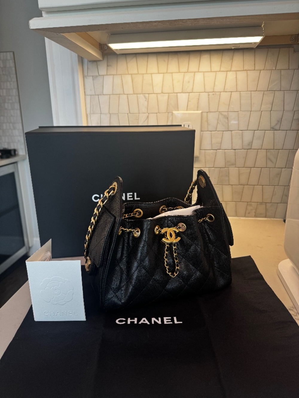 Chanel 25 mini black caviar gold hardware